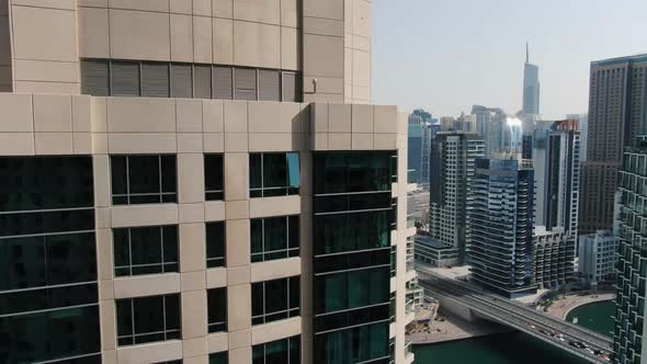 Drone is Flying Between the Skyscrapers View on Dubai Creek UAE Vacation