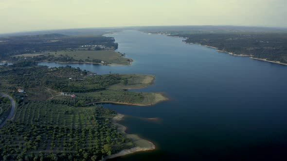 Golden Sunset Over The Large fluvial beach At The Vast Rural Area Of Alentejo