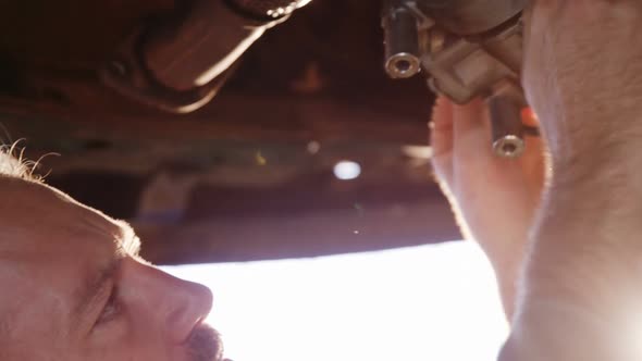 Mechanic examining a car