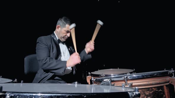 Musician Playing the Timpani