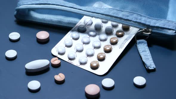 Birth Control Pills on Blue Background, Top View 