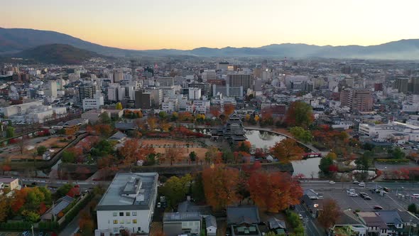 Aerial View 4k footage of Matsumoto Castle on morning in Matsumoto city.