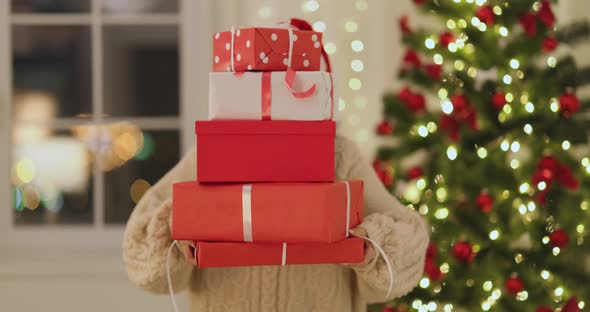 Funny Christmas Santa Woman With Gifts at Home
