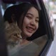 Lovely Asian Girl Holds A Cat On Her Lap In The Passenger Seat Of A Driving Car - VideoHive Item for Sale