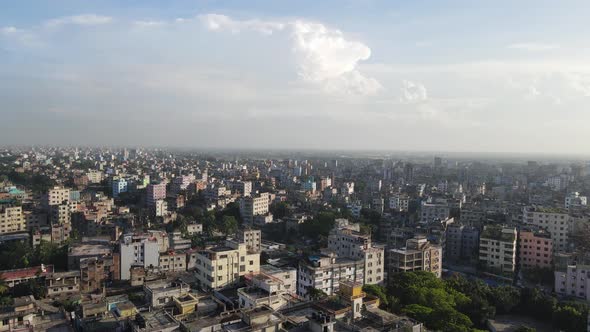 Aerial city view with high rise buildings, urbanization concept - sunny day with blue sky and clouds