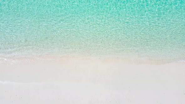 Aerial view of drone. Scene of top view beach and seawater on sandy beach in summer.