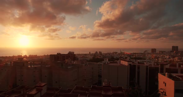 Timelapse in Tenerife in Spain. View of Santa Cruz De Tenerife. Red, Yellow and Orange Sunrise