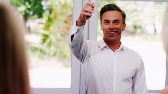 Smiling man toasting champagne glass