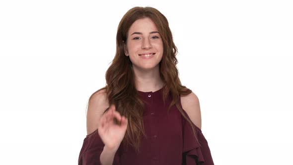 Closeup Portrait of Cheerful Adult Woman 20s Looking at Camera with Smile Gesturing with OK Sign