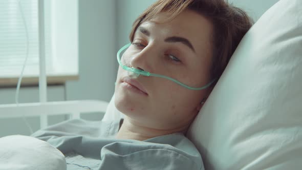 Portrait of Female Patient with Nasal Cannula in Hospital