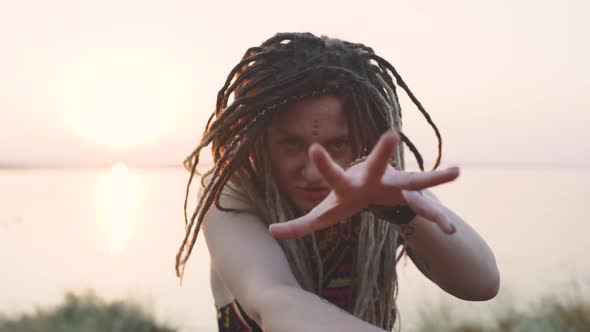 Attractive Hippie Woman with Dreadlocks at Sunset Having Good Time and Dance Outdoors