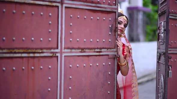 Shy Indian Bengali Bride comes inside house from gate