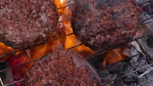 Searing beef burgers for hamburgers on BBQ grill