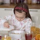 Kid Preparing Breakfast Bowl in Kitchen - VideoHive Item for Sale