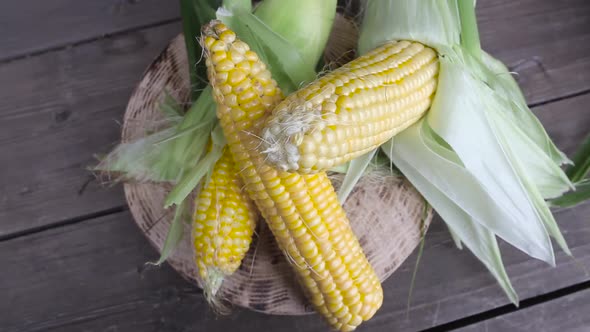 Natural Corn on a Wooden Background. Organic Vegetables Concept, Close-up