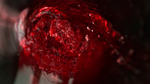 Super Slow Motion Abstract Shot of Red Wine Pouring in Glass Bottle at 1000 Fps