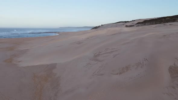 Drone View Flying Over Sand Dunes Towards Coast