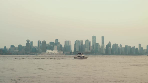 Sailing Yacht on cloudy day with Vancouver skyline in background