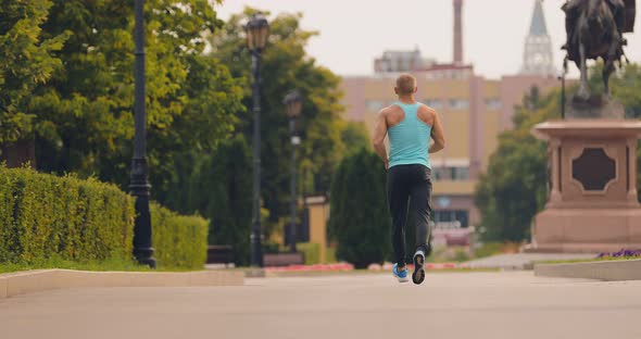 Young Male Athlete is Running Training