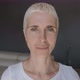 Blond woman with short hair and blue eyes posing at camera - VideoHive Item for Sale
