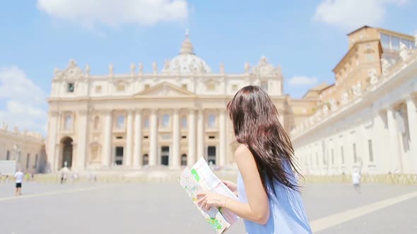 Happy Young Woman with City Map in Vatican City