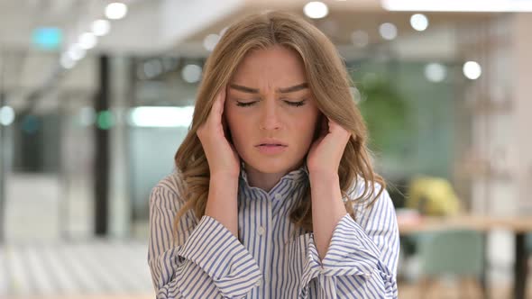 Portrait of Exhausted Businesswoman Having Headache