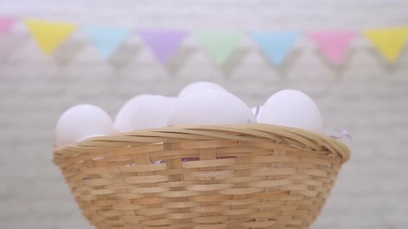 Rotation Shot of White Fresh Raw Chicken Eggs in Basket Happy Easter