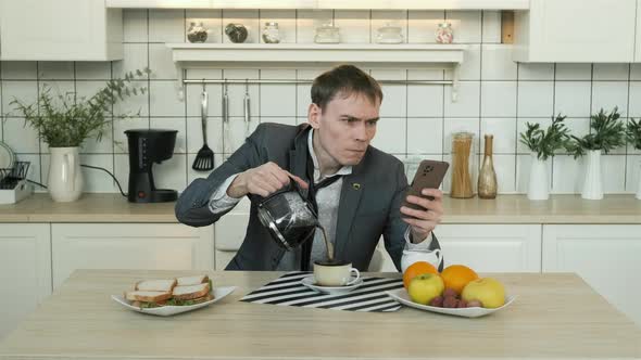 Cinemagraph of Man with Smartphone Pouring Coffee