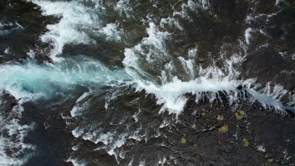 Aerial top-down view of Bruarfoss waterfall with turquoise water, South Iceland