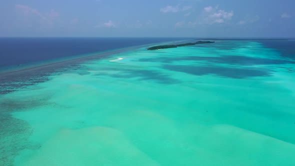 Aerial top view tourism of relaxing resort beach time by transparent lagoon with white sand backgrou