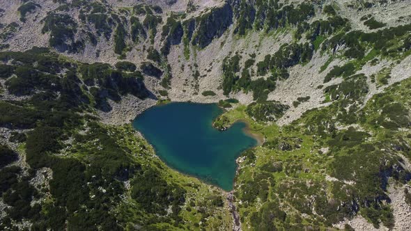 Aerial View of a Lake in the Pirin Mountains with Blue Clear Water