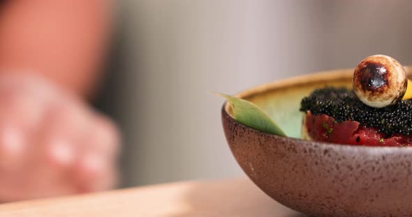 Plate Of Delicious Tuna Sushi Topped With Black Roe In A Japanese Restaurant - close up, tracking sh