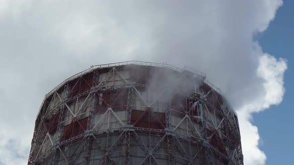 Industrial with Thermal Power Plant and Electric High Voltage Towers in Sunlight