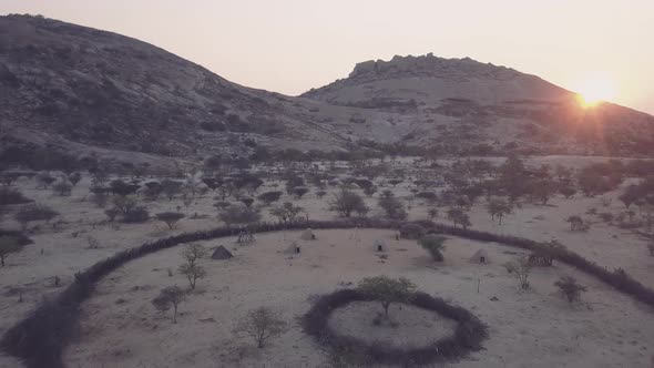 Aerial view of a traditional village in desert at sunset, Angola