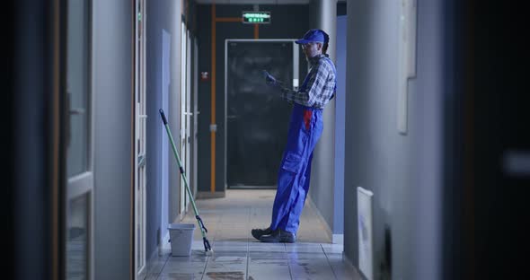 Janitor Using a Smartphone