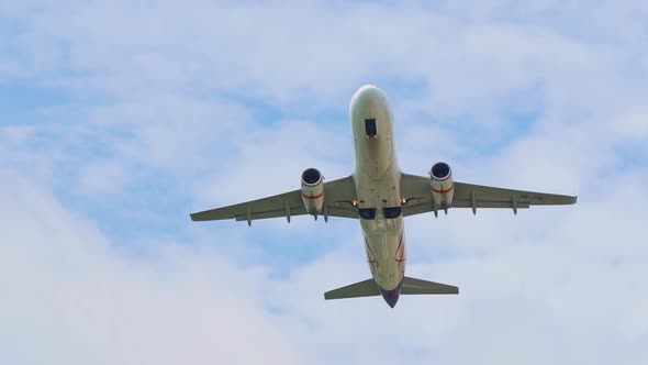 Plane Takes Off From the Airport the View From Below From the Ground Wings Against the Sky