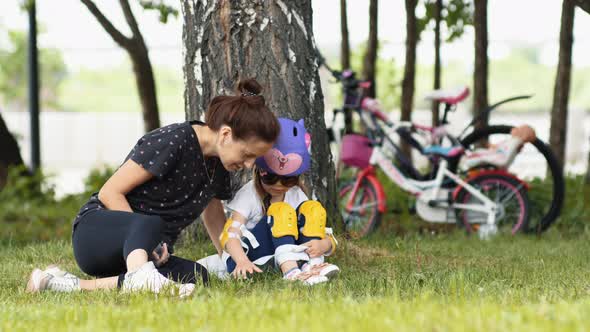 Mother And Daughter In Park