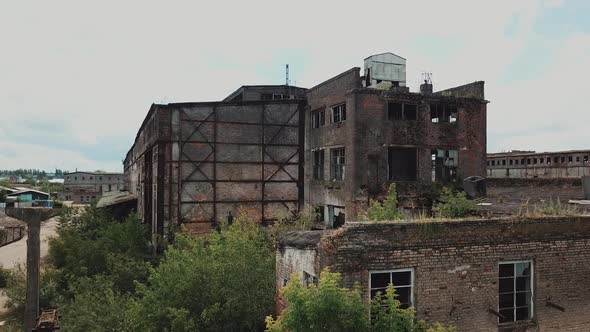 Aerial view from the air to an abandoned factory. Old industrial building for demolition.