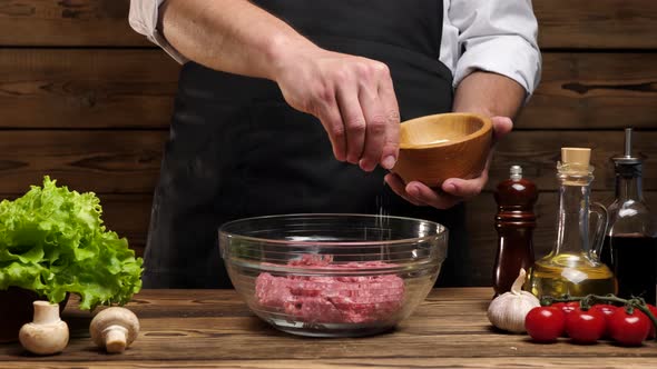 Chef Salting Freshly Cooked Ground Beef