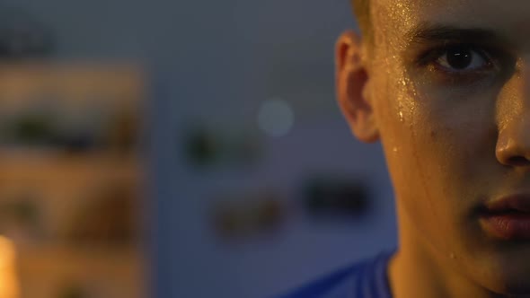 Sweaty Teenager Looking to Camera After Intensive Workout in Gym, Serious Face