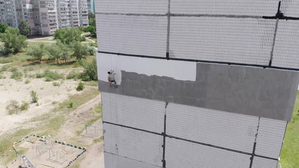 Industrial Climber Painting Building Facade Wall, Insulation Work, Aerial View