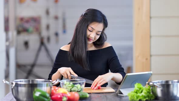 Modern Pretty Asian Female Housewife Cooking Fresh Salad Chopping Vegetable Using Knife