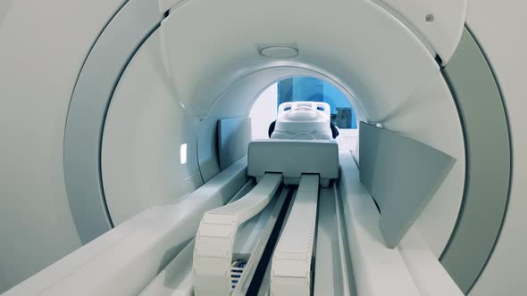 Patient Is Moving Out of the CT Scanner