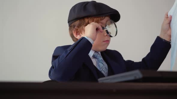 Focused Businessman Researching Paper Document with Magnifying Glass in Office