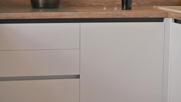 Tilt Closeup Shot of Modern White and Wooden Beige Kitchen Interior