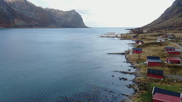 Drone Rising Over Fisherman's Huts And Fjord