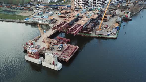 Aerial View of Construction of Bridge of a New Highway Across River in Moscow