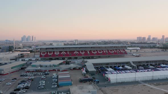 Aerial view of empty Dubai Autodrome grand stand and paddock at sunrise