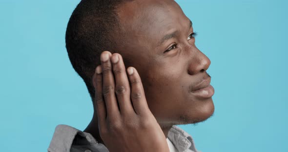 Profile of Black Man Touching His Painful Ear