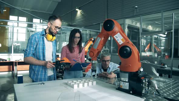 Science School Students Are Holding an Experiment with Robots